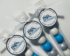 three blue and white candy sticks with an airplane on them