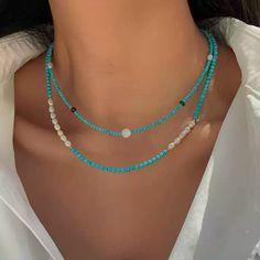 This delicate necklace brings together the serenity of turquoise beads with the subtle shimmer of moonstone. Each piece is meticulously crafted with natural freshwater pearls and blue turquoise accents, offering a unique combination of textures and colors. The adjustable chain ensures a comfortable fit, making this necklace perfect for layering or wearing on its own for a minimalist, chic look. Details Material: 24K gold-plated brass, natural freshwater pearls, turquoise, and moonstone Length: 46cm, 47cm, 46cm (with 5.5cm extension) Weight: Approx. 5.3g, 7.0g, 8.0g Style: Elegant and versatile, perfect for both casual and formal occasions Care Tips: Avoid exposure to harsh chemicals and keep dry to maintain its beauty Missy Jewelry Natural Stone Necklace Collection White Turquoise Necklace With Natural Stones, Adjustable, Elegant Turquoise Multi-stone Necklace, Elegant Turquoise Multi-stone Necklaces, Blue Multi-strand Turquoise Necklace With Gemstone Beads, Gift-ready Polished Turquoise Bead Necklace, Turquoise Accents, Natural Stones Necklace, Turquoise Bead Necklaces, Pearl Jewelry Necklace