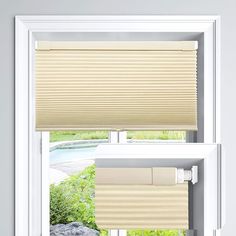 an open window with two shades on it