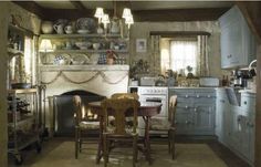 an old fashioned kitchen with blue cabinets and white stove top oven in the center is featured on food2 features