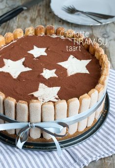 a chocolate tart with white stars on it