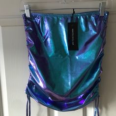 Blue/Purple Metallic. Size M Casual Purple Skirt For Night Out, Blue Mini Skirt For Festival, Casual Purple Mini Skirt For Party, Fitted Purple Skirt For Club, Blue Club Skirt For Spring, Blue Mini Skirt For Spring Club Outing, Blue Mini Skirt For Spring Clubbing, Blue Spring Skirt For Club, Blue Skirt For Spring Clubbing