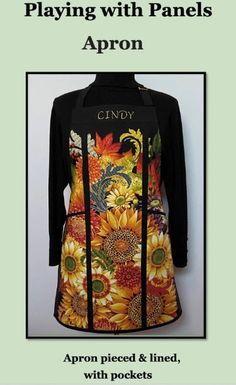 a black shirt with sunflowers on it and the words candy written in gold