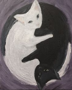 two black and white cats sitting on top of each other in front of a full moon