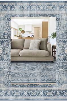 a living room filled with furniture and a large blue framed photo over the top of it