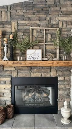 a living room with a stone fireplace and mantle