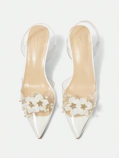 These Floral Clear Heel Pumps are the perfect addition to your summer vacation wardrobe. Featuring an elegant design and a clear heel, these shoes will elevate any outfit. Whether you're strolling through the city or lounging on the beach, these shoes will provide both style and comfort. Details : Pearls Color : White Toe : Point Toe Heel Height : Mid Heel Upper Material : TPU US Size Ball Girth Foot Length Heel Height US5 EUR35 8.1 8.7 3.1 US6 EUR36 8.3 8.9 3.1 US6.5 EUR37 8.5 9.2 3.1 US7 EUR38 Spring Clear Closed Toe Jelly Sandals, Spring Clear Closed-toe Jelly Sandals, Elegant Round Toe Jelly Sandals For Party, Clear Closed Toe Jelly Sandals For Spring, Spring Clear Heels With Clear Strap, Clear Sandals For Spring Wedding, Clear Heels With Clear Strap For Spring, Clear Strap Heels For Spring, Spring Wedding Clear Sandals