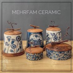 four ceramic canisters with designs on them and the words mehrram ceramics