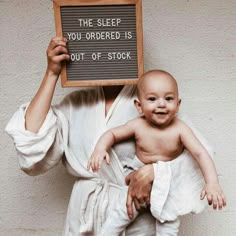 a man holding up a sign that says the sleep you ordered is out of stock