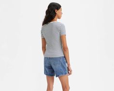 It may look like a T-shirt, but upon closer inspection, our Britt Snap-Front Top is anything but. With snap button closure and a slim fit through the body and sleeve, this supersoft top tucks into a pair of Levi's® denim with ease. Slim fit through the body and sleeves Features a snap button closure Fitted Casual T-shirt With Button Closure, Fitted Spring T-shirt With Button Closure, Levi's Tops With Button Closure For Spring, Levi's Relaxed Fit Tops For Work, Levi's Cotton Tops With Button Closure, Levi's Crew Neck Tops For Summer, Trendy Fitted Levi's Tops, Fitted Levi's Cotton T-shirt, Levi's Fitted Cotton T-shirt