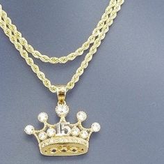 A beautiful crown for the princess that turns 15, all in 14k gold With a 20 inch and 2mm thick, rope style necklace in 14k gold for just $489.00! Pendant is 15mm in height and 20mm width, with zirconia synthetic stones. Gift box is included. Una hermosa corona para la princesa que cumpla sus 15 años en oro de 14k Con una cadena estilos torzal de 20 pulgadas y 2mm de gruesa, en oro de 14k por tan solo $489.00! El pendiente esta 15mm de alto y 20mm de ancho, con piedras zirconia seteticas . Caja d Elegant Crown Design Jewelry For Birthday, Elegant Crown Design Jewelry For Birthdays, Luxury Gold-plated Rope Chain Jewelry, 14k Gold Crown Design Fine Jewelry, 14k Gold Rope Chain Jewelry For Gift, 14k Gold Rope Chain Jewelry As Gift, White Gold Rope Chain Jewelry For Anniversary, Luxury Gold Crown Jewelry, Gold Plated Rope Chain Pendant