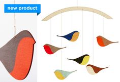 a mobile with birds hanging from it's sides and the words new product above it