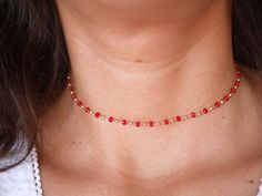 This modern stacking  chocker necklace is made with Gold Plated Rosary Chain adorned with Red Cristal Glass Beads. ➵ Perfect to wear as Chocker or Double turn Bracelet.➵ The necklace length is ajustable thanks to 5 cm extender chain.--*--*--*--*--*--*--*--*--*--*--*--*--*--*--*--*--*--*--∞ SIZE ∞- length: 32 cm (12,6 in) to 37 cm (14,6 in) with the little extender chain.Closing-system : Adjustable∞ MATERIAL ∞- Gold plated over brass- Cristal BeadsNickel free jewelry !∞ COLOR ∞- Gold- Red--*--*-- Adjustable Chain Choker With Round Beads, Gift Choker With Adjustable Chain And Round Beads, Trendy Red Beaded Choker Necklace, Adjustable Red Dainty Necklace, Red Adjustable Dainty Necklace, Dainty Adjustable Red Necklace, Red Beaded Choker Necklace As Gift, Red Beaded Dainty Jewelry, Red Beaded Choker Necklace For Gift