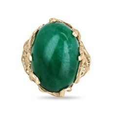 This impressive solitaire ring features a stunning centerpiece in the form of a huge 19-carat oval cabochon cut emerald from Colombia, prized for producing some of the world's most beautiful emeralds. The emerald displays a rich, dark green color that is truly captivating. The emerald is securely set in a unique 14k gold nugget style setting, with nugget prongs that add to the rugged, organic feel of the design. The result is a striking and unforgettable piece of jewelry that is sure to turn heads. Setting Style: Prong-Solitaire  Setting Material: 14K Yellow Gold Setting Weight: 11.0 Grams Main Stone: Emerald Cut: Cabochon Shape: Oval Weight: 19.0-Carats Clarity: Translucent  Color: Green Luster: Very Good Treatments: Natural, Oiling Origin: Colombia Estimated Retail Value: $14,590.00 USD Luxury Green Emerald Ring Oval Cabochon, Luxury Hallmarked Oval Cabochon Emerald Ring, Luxury Green Oval Cabochon Emerald Ring, Luxury Elegant Emerald Ring Oval Cabochon, Luxury Oval Cabochon Emerald Ring With Prong Setting, Luxury Polished Emerald Ring, Oval Cabochon, Luxury Gold Oval Cabochon Emerald Ring, Luxury Emerald Ring Oval Cabochon, Luxury Gold Emerald Ring With Oval Cabochon