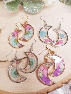 These nature inspired earrings are the perfect addition to your jewelry collection! They are made with real pressed flowers cast in epoxy resin. They're super lightweight making them easy to wear all day.  The perfect Birthday or Anniversary gift for the witchy woman in your life!  *do not wear in water  *handmade with high quality hypoallergenic and nickel free findings. Wanna show off your new earrings? We'd love to see you strutting your stuff  with your new  earrings so be sure to tag us wit Cottagecore Earrings, Gift Flower, New Earrings, Lightweight Earrings, Witchy Woman, Resin Earrings, Birthday Gift For Her, Light Weight Earrings, Perfect Birthday