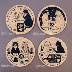 four coasters with cats sitting at a table