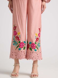 Step into sophistication with this soft pink chanderi pants, adorned with intricate threadwork and captivating cutwork. These pants embody elegance and charm, perfect for adding a touch of refinement to any ensemble. Summer Floral Embroidery Palazzo Set Straight Pants, Summer Floral Embroidered Straight Palazzo Set, Summer Palazzo Set With Floral Embroidery, Summer Floral Embroidery Palazzo Set, Bohemian Embroidered Pink Palazzo Set, Spring Embroidered Pink Palazzo Set, Bohemian Pink Embroidered Palazzo Set, Festive Wide Leg Palazzo Set With Floral Embroidery, Pink Bohemian Palazzo Set With Chikankari Embroidery