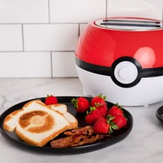 a plate with toast, strawberries and bacon on it next to a poke ball