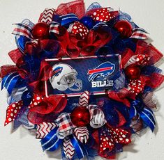 a football helmet wreath with red, white and blue bows