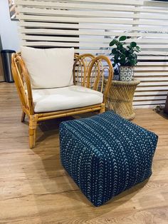 a chair and ottoman in a room with wooden floors