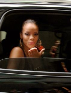 a woman sitting in the passenger seat of a car