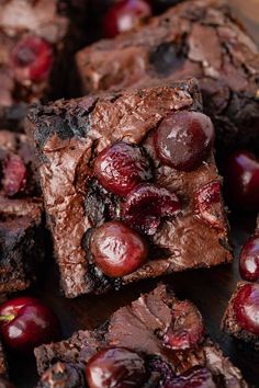 some brownies with cherries are on a table