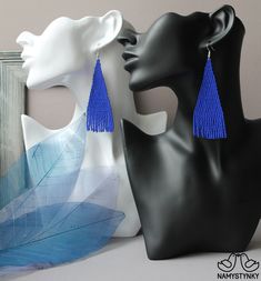 These blue beaded earrings are made of high-quality Czech beads and strong synthetic thread. They are elegant, fashionable, and highly versatile, suitable for everyday wear. Features: Sterling silver components Color: blue Length (approximate): 9.2 cm (3.62 in) This item is currently in stock. More beaded earrings http://etsy.me/2ycItdb Gerdan necklaces http://etsy.me/2mihf0J Beaded necklaces http://etsy.me/2Dkf1Fo Crochet necklaces http://etsy.me/2CAPdFc Back to shop https://www.etsy.com/shop/N Blue Beaded Fringe Drop Earrings, Blue Tassel Drop Earrings With Dangling Beads, Blue Tassel Earrings With Dangling Beads, Elegant Blue Tassel Earrings With Beaded Fringe, Blue Beaded Tassel Dangle Earrings, Blue Beaded Tassel Drop Earrings, Elegant Blue Chandelier Earrings With Colorful Beads, Elegant Blue Beaded Fringe Earrings, Elegant Blue Beaded Chain Earrings