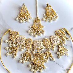 Gorgeous kundan and meenakari bridal set with earrings, teeka and jhoomer. Affordable Meenakari Jewelry For Puja, Traditional Meenakari Chandbali Sets, Traditional Kundan Wear With Tilla For Eid, Traditional Wear With Tilla And Kundan For Eid, White Kundan Jhumkas For Wedding, Diwali Kundan Chandbali Sets, Bollywood Style Kundan Anarkali Set With Stone Work, Eid Kundan Chandbali Sets, White Bridal Sets For Eid Festive Occasion