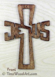 a wooden cross with the word jesus on it