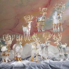 a group of christmas figurines sitting on top of a table