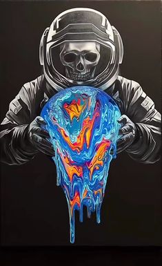 a man in a space suit holding a blue and orange object with dripping paint on it