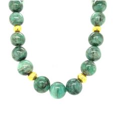 This impressive strand of emerald beads showcases a stunning combination of elegant green and bright yellow gold that is flattering to all complexions! The 15mm round emerald beads have beautiful black veining that gives the necklace a gorgeous dramatic effect. Rich 22kt yellow gold beads with their hammered finish add a luxurious feel to this necklace that is suitable both for daytime and evening wear. A lovely 14k yellow gold hammered ball clasp completes the necklace perfectly. 18 inches fini Emerald Bead, Gold Beads, Bright Yellow, Gold Accents, Evening Wear, The Necklace, Emerald, Beaded Necklace, Fine Jewelry