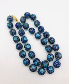 Absolutely beautiful vintage/antique Chinese export 800 silver and enamel beaded necklace. Large chunky sterling silver enameled open work beads in two shades of blue. Hand knotted on silk with sterling silver vermeil clasp. The push in box clasp works perfectly and it secure but the small tongue is missing. Enough of the clasp is there to open and close. May want to replace the piece but it works well. Not marked in any way but acid is as 800 silver (continental silver) I have looked each bead Traditional Blue Oval Beads Jewelry, Traditional Blue Oval Beaded Jewelry, Meenakari Round Beads For Gifts, Meenakari Beads For Gifts, Traditional Collectible Round Beads Necklace, Traditional Enamel Necklaces For Formal Occasions, Traditional Blue Polished Beads Jewelry, Traditional Blue Jewelry With Polished Beads, Vintage Blue Enamel Necklace