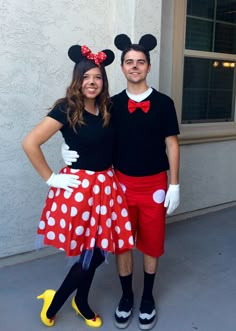 a man and woman dressed up as mickey mouse and minnie mouse from the disney movie