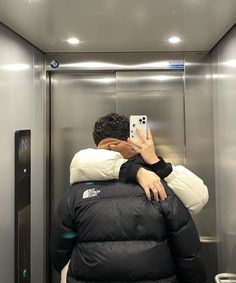 a person taking a selfie in an elevator