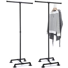 two garment racks with clothes hanging on them