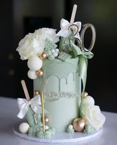 a cake decorated with flowers and scissors on a table