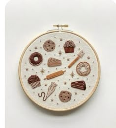 an embroidery kit with different types of food and sweets on the front, including doughnuts