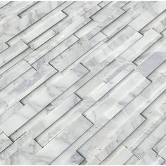 an image of white marble tiles that look like they have been made into a wall