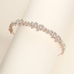 This brilliant headband boasts Austrian rhinestones in a "floral" like design. Measuring 1" wide, this sparkling rose gold wedding headpiece is sure to add beauty and elegance to your special day! Perfect for the bride who wants an all crystal look. Now in bright silver, silver, gold or rose gold! DETAILS * High quality crystals.  * Measures 1 inch wide. * Loops on each end to secure with bobby pins. * Perfect for the bride, weddings, parties, or any special occasion. * Finish: silver, gold or r Rose Gold Wedding Headpiece, Rose Gold Headband, Gold Bridal Headband, Wedding Hairstyles And Makeup, Headpiece Wedding Hair, Sparkling Rose, Crystal Tiara, Ribbon Headbands, Rhinestone Tiara