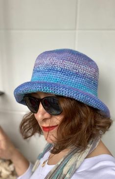 This colorful crochet bucket hat for men and women is made with doubled premium cotton mix.  Since double string,  it feels bit thicker and firmer. It's a very stylish accesory for summer time; chic, soft and comfortable. It's a great sun visor in your daily use, at the beach and at fun places like summer festivals. The material is very soft and firm at the same time; fits very well and feels very comfortable on the head. It is so flexible that you can shape and use the brim differently as you w Spring Cotton Yarn Brimmed Bucket Hat, Spring Wide Brim Cotton Yarn Bucket Hat, Spring Cotton Yarn Bucket Hat With Brim, Knitted Brimmed Cotton Sun Hat, Spring Brimmed Bucket Hat In Cotton Yarn, Hand Knitted Brimmed Crochet Cotton Hat, Hand Knitted Wide Brim Bucket Hat For Summer, Knitted Cotton Yarn Brimmed Sun Hat, Hand Knitted Wide Brim Summer Bucket Hat