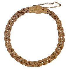 A very fine 14k gold Etruscan style bracelet. With three delicate strands of woven braided gold wire terminating in an Etruscan style box clasp with granulated and wire work decoration. Set with a safety chain. Simply a finely-made Etruscan style bracelet! Date: 20th Century Overall Condition: It is in overall good, as-pictured, used estate condition with some very fine & light surface scratches and other signs of expected light wear consistent with age. Fineness: Marked 14k for gold fineness. M Elegant Braided Bracelet Jewelry, Formal Yellow Gold Jewelry With Interwoven Design, Elegant Braided Jewelry As Gift, Elegant Gold Braided Jewelry, Elegant Braided Jewelry For Gifts, Classic Gold Braided Bracelet For Formal Occasions, Elegant Braided Bracelets For Formal Occasions, Classic Braided Jewelry For Formal Occasions, Braided Yellow Gold Jewelry Gift