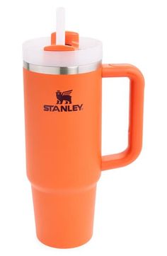 an orange travel mug with a stainless steel lid and straw in the cup is shown