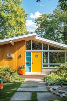 a small yellow house with a blue door