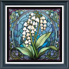 a stained glass window with lily of the valley flowers