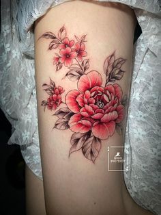 a woman's thigh with flowers on it