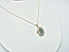 "For Sale: (1) H280 Stunning 14k Yellow Gold Emerald Necklace with Multiple Diamonds PLEASE READ ENTIRE DESCRIPTION BEFORE PURCHASING Pre-owned item. This is beautiful 14k yellow gold necklace featuring pear shaped Emerald in the center with multiple diamonds of different shape around it. No visible flaws, just some scratches please see pictures for details. Sold as is, as seen on pictures. There are earrings available that go with this necklace, and those earrings sold separately. Specifics: * Formal Heirloom Necklace Stamped 14k, Yellow Gold Emerald Necklace With Diamond Accents For Wedding, Hallmarked Oval Diamond Necklace In Fine Jewelry Style, Oval Hallmarked Diamond Necklace In Fine Jewelry Style, Formal Fine Jewelry Custom Yellow Gold Necklace, Wedding Oval Emerald Necklace With Jewels, Elegant 14k Gold Hallmarked Emerald Necklace, Elegant Gold Emerald Necklace With Prong Setting, Heirloom Yellow Gold Necklace With Diamond Accents