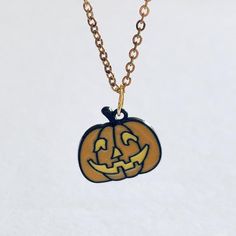 Gold pumpkin necklace. Spooky retro looking orange pumpkin face, Halloween necklace on dainty gold plated over STAINLESS STEEL chain. Witchy woman jewelry gothic girl 

*No offers pls

*gold plated over STAINLESS STEEL chain
*chain measures approx 18” long
*charm measures approx 0.7” long
*has lobster claw claps closure
*charm is enamel & black alloy 
*gift box not included 
*comes on a jewelry card in a clear seal bag 


#necklace #halloween #pumpkin #Witch #gothic Gold Pumpkin, Bag Necklace, Pumpkin Necklace, Gold Pumpkins, Gothic Girl, Halloween Necklace, Jewelry Gothic, Woman Jewelry, Pumpkin Face