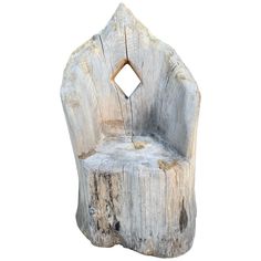 a chair made out of wood with a hole in the middle