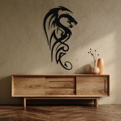 a black dragon wall decal on the side of a wooden cabinet in a living room